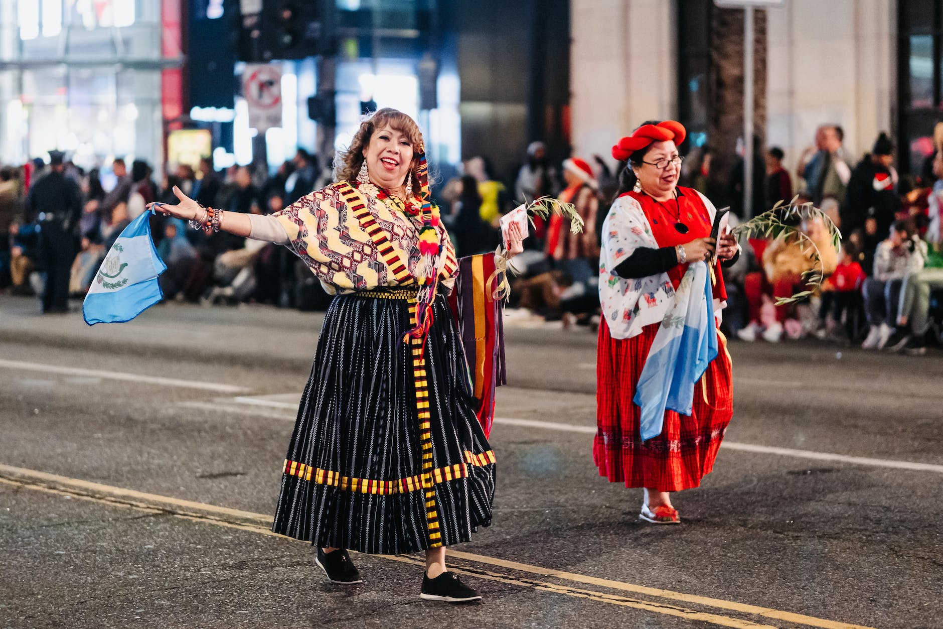 people in costumes on a parade in city